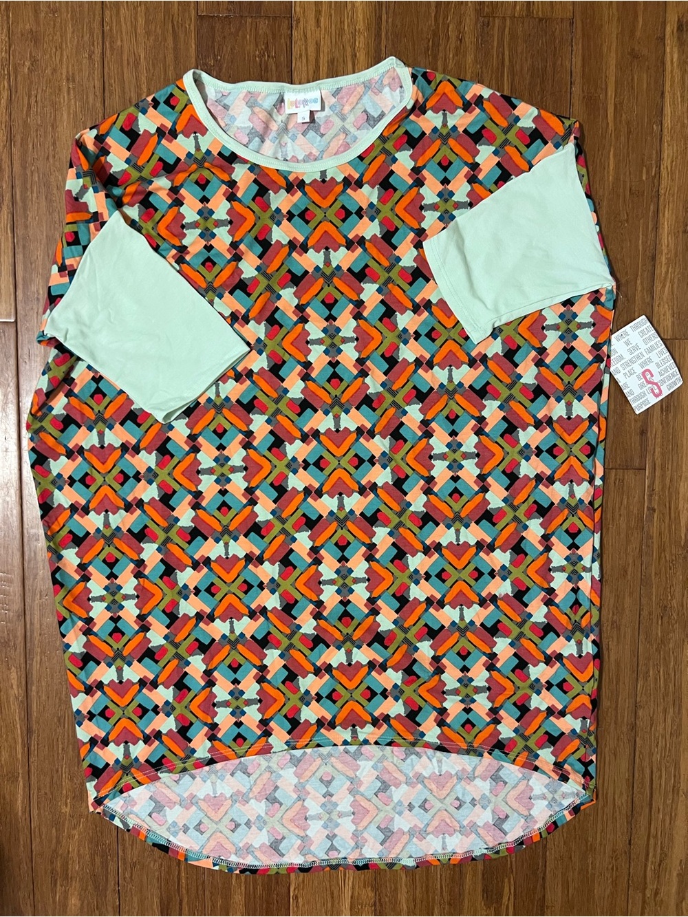 LuLaRoe Irma Pastel Geometric Top with Mint Trim